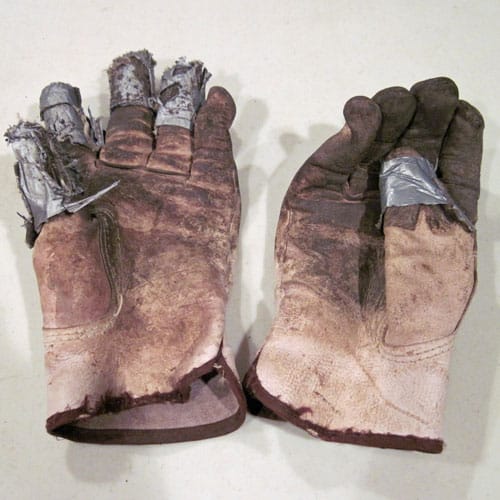Repaired-garden-gloves Garden gloves repaired with duct tape
